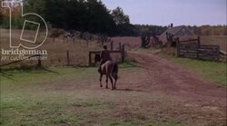 Man on horseback riding through the countryside, 1908 - reenactment. Clip 5 Stock Footage