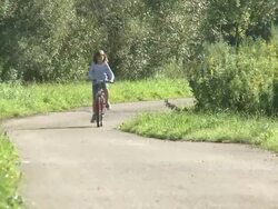 WS Girl with bicycle / Kastel-Staadt, Rhineland-Palatinate, Germany   Stock Footage
