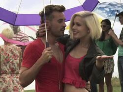 Young couple at festival with umbrella Stock Footage