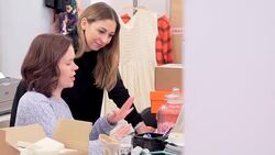 Fashion buyers working at desk in office Stock Footage