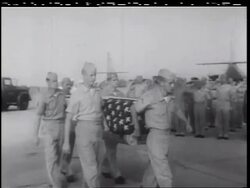 B/W 1960s PAN soldiers carrying American flag-covered coffin onto aircraft / Vietnam War Stock Footage