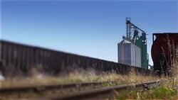 Freight Train Leaving Grain Elevator Stock Footage