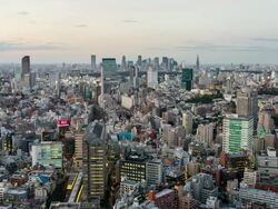 WS T/L View of sunset over ebisu station with shinjuku high rise buildings skyline / Tokyo, Japan Stock Footage