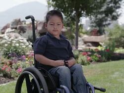 Face shot of latino boy smiling and squinting. Stock Footage