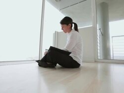 Business woman sits alone in empty office Stock Footage