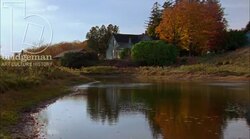 Static shot of a country home by a river, clip 2 Stock Footage