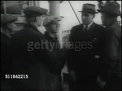 1937: MARITIME COMMISSION: Seamen at docks w/ inspector, other seamen w/ different inspector. DRAMATIZATION: Seamen in cramped living quarters, sailors at table w/ male SOT saying 'take this up to old man...refuse to eat it.' Instructional Video