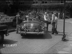 1952: COLLEGE CAMPUS: VS Convertible car pulling up to parking space, students helping unload luggage, INT 'Susan' arriving at dormitory room at Carnegie Mellon University (Carnegie Tech), males inviting Susan to Fraternity party (SOT). Instructional Video