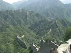 WA view over Great Wall of China snaking over forested mountains, Badaling, China Stock Footage