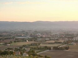 WS PAN HA View of Assisi valley at sunset from Sacro Convento Saint Francis Upper Basilica / Assisi, Umbria, Italy Stock Footage