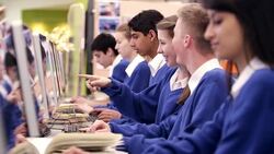 Students talking and studying in school computer lab Stock Footage