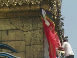 CU ZO Man performing maintenance tasks on Boudhanath   / Kathmandu, Central, Nepal Stock Footage