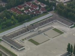 WS AERIAL ZI View of darkest page of humanity at Dachau concentration camp and houses / Germany Stock Footage