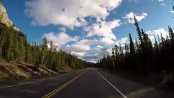 Car driving on Icefields parkway scenic road Stock Footage
