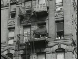 Apartment building residents sleep on their fire escapes during a heatwave. News Clip