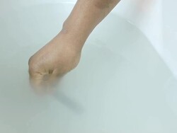 HD: African American Woman Holding a Baby Testing Bath Water Stock Footage