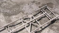 A piece of mining equipment sits on special tracks in a granite quarry. Stock Footage