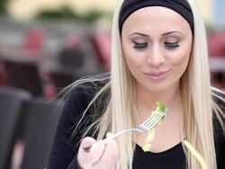 Girl eating in Restaurant (HD) Stock Footage