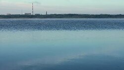 Factory chimneys, lake Stock Footage