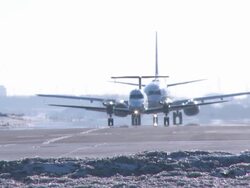 Conga line, two airplanes in winter - WideShot Stock Footage