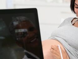 CU DS Doctor Performing Sonogram on Pregnant Woman / Richmond, Virginia, USA Stock Footage