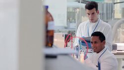 Scientists using digital tablet for experiment in laboratory Stock Footage