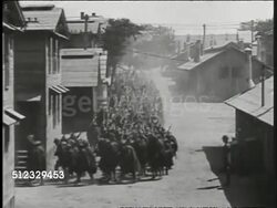 1918: WWI US TROOPS: HA WS American soldiers marching in long formation down dirt street, town or barracks. Soldiers on horseback leading troops in rain gear through mud. Soldiers & artillery horses hurrying across open field. Instructional Video
