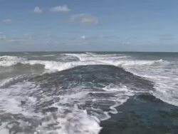 WS View of wave breaker at beach of Ostend / Ostend, Flanders, Belgium / Ostend, Flanders, Belgium Stock Footage