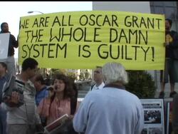 Protestors gathered outside an Oakland, California courtroom as a former Bay Area transit officer charged with murdering an unarmed man on a train platform was back in court for a hearing expected to shed more light on the shooting. News Clip