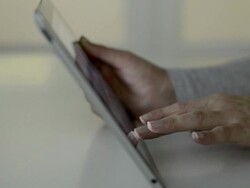Dolly,L to R Female using tablet computer  Stock Footage