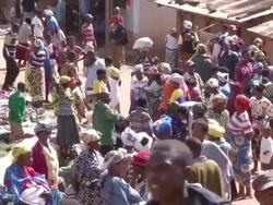 MS Shot of many people walking at outdoor marketplace / bwindi, kabale, uganda Stock Footage