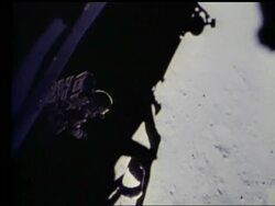 high angle of John Young stepping off lunar lander onto Moon Stock Footage