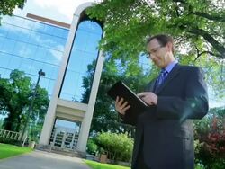 Business man uses a tablet Stock Footage