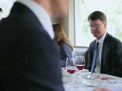 PAN MS Four businessmen having business meeting at table in restaurant/Washington, USA Stock Footage