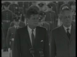 June 29, 1963 FILM MONTAGE John F. Kennedy getting off plane at Gatwick Airport/ WS Soldiers and press at airport/ Kennedy giving speech as Harold Macmillan stands by/ London, England/ AUDIO Stock Footage