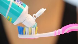 Press toothpaste to toothbrush for brushing your tooth with full HD Video. Stock Footage