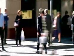 MS time lapse, business man on rollerblades weaves in and out of traffic and pedestrians Stock Footage