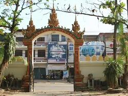 MS SLO MO Arched entrance with buddhist decorations trees / Vientiane, Laos Stock Footage