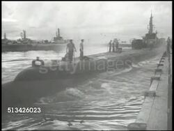 1940s: UNITED STATES NAVY:  VS Sign, 'U.S. Navy sub section base.' WS U.S. Navy submarine launching, departing dock, men standing on deck. WWII, World War II, Pacific Front, submersible, naval warfare, Salmon-class sub Instructional Video