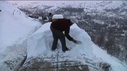 Heavy snow blocks roads and burries homes in disputed region Instructional Video