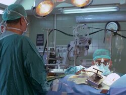 Surgeons operating a patient Stock Footage