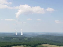 WS AERIAL ZI ZO DS Steam coming from hidden towers through forest area/ Walloon Region, Walloon Region, Belgium Stock Footage