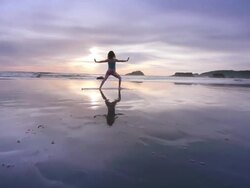 WS POV ZO Woman doing yoga on beach / Bandon, OR, United States  Stock Footage