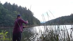 Fisherman throws fishing tackles Stock Footage