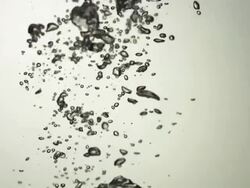 CU SLO MO Shot of bubbles moving up through frame / United Kingdom Stock Footage