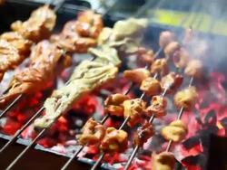 Indian chef preparing assorted Barbequed Chicken Tandoori at Roadside Shop Stock Footage