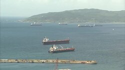 Rooftops of Gibraltar and ships in harbour News Clip