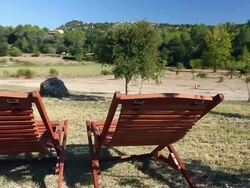 Two deck chairs and Spanish landscape Stock Footage