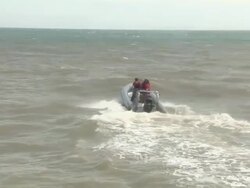 Kite surfers approach the English coastline Stock Footage