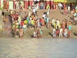 MS ZO People getting out from dakshineshwar temple and getting steps down in hooghly river for prayer / Kolkata, West Bengal, India Stock Footage